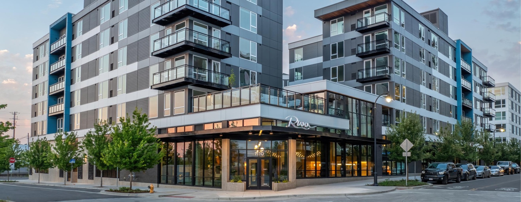 Street-level view at dawn of Broadstone Riva, offering affordable apartments in Vancouver